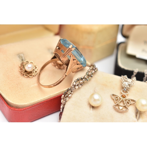 141 - A SMALL ASSORTMENT OF JEWELLERY, to include a yellow metal and topaz dress ring, stamped 9ct, ring s... 