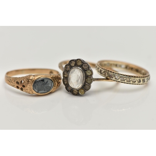 142 - THREE GEM SET RINGS, to include an AF 9ct gold hematite intaglio signet ring, open work detailed sho... 