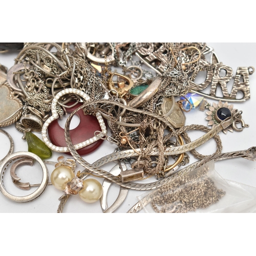 144 - A BAG OF ASSORTED JEWELLERY, to include a tangled yellow metal trace chain with spring clasp stamped... 