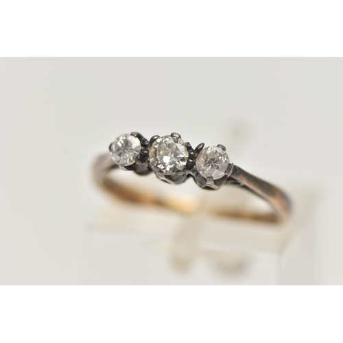 159 - TWO THREE STONE DIAMOND RINGS, the first an old cut diamond and two single stone diamonds, bezel set... 