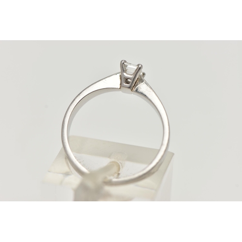 162 - A PLATINUM SINGLE STONE DIAMOND RING, emerald cut diamond prong set in platinum, leading on to a pin... 