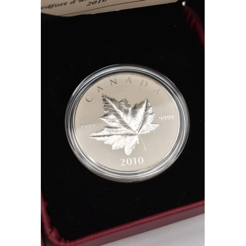 174 - A 2010 ROYAL CANADIAN MINT PIEDFORT 1OZ  5 DOLLARS MAPLE COIN, TOGETHER WITH A 2011 $20 CRYSTAL SNOW... 