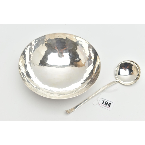 194 - AN ELIZABETH II PLANISHED SILVER BOWL AND MATCHING LADLE, the bowl with domed base and the ladle wit... 