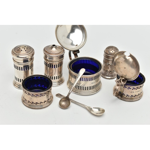 196 - TWO 20TH CENTURY THREE PIECE SILVER CRUET SETS, comprising a George VI cylindrical set of salt and p... 