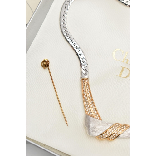 203 - A 'CHRISTIAN DIOR' NECKLACE AND YELLOW METAL STICK PIN, a bi colour necklace with a cross over desig... 