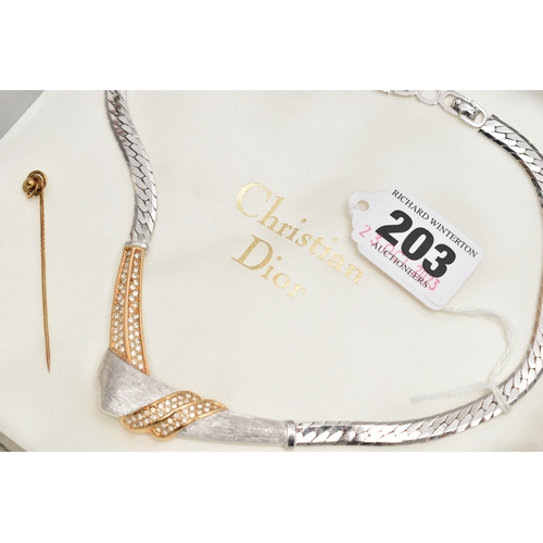 203 - A 'CHRISTIAN DIOR' NECKLACE AND YELLOW METAL STICK PIN, a bi colour necklace with a cross over desig... 