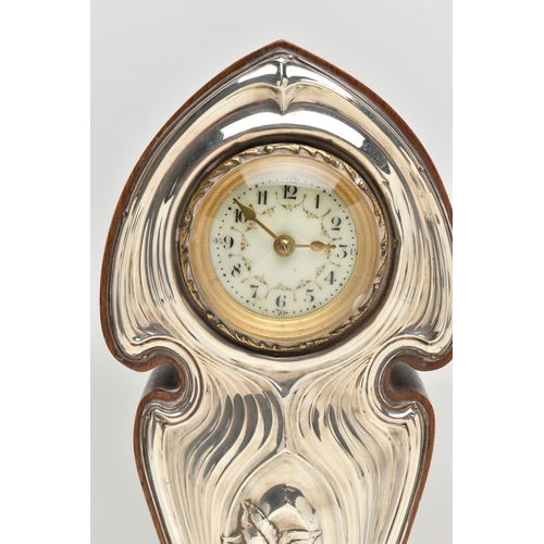 223 - A GEORGE V ART NOUVEAU SILVER MOUNTED WALNUT MANTEL CLOCK, the repoussé front with sinuous scrolls a... 