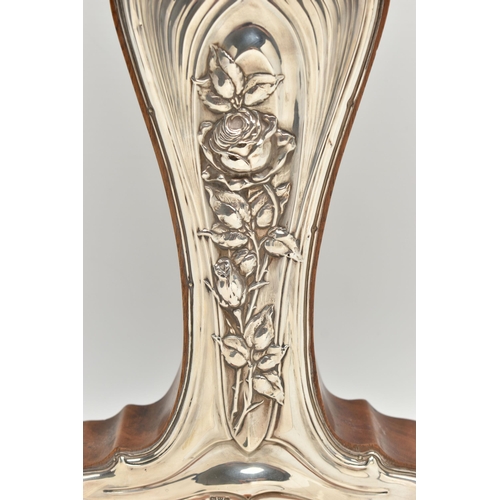 223 - A GEORGE V ART NOUVEAU SILVER MOUNTED WALNUT MANTEL CLOCK, the repoussé front with sinuous scrolls a... 