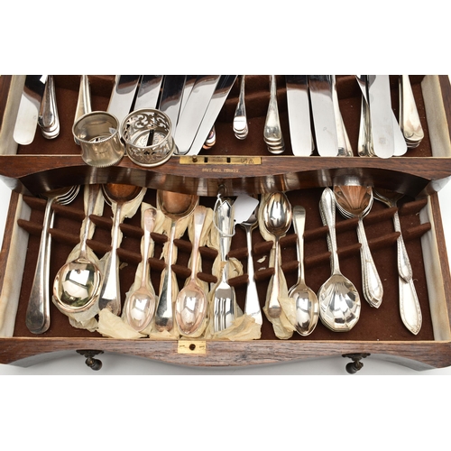 236 - A WOODEN CANTEEN, stainless steel cutlery for a twelve person table setting, knives fitted with ivor... 