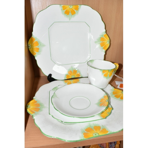 370 - AN ART DECO AYNSLEY TRIO AND TWO CAKE PLATES, pattern number 5102, 'Butter Cup' Art Deco design with... 