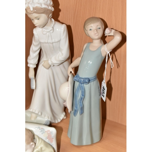 403 - THREE LLADRO AND NAO FIGURES, comprising Coiffure Girl with Straw Hat, model no 5010, sculptor Franc... 