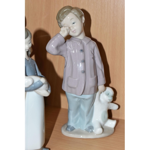 405 - A GROUP OF LLADRO AND NAO FIGURES, comprising Lladro: Trying on a Straw Hat, model no 5011, sculptor... 