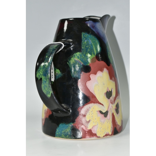 410 - A STUDIO POTTERY JUG BY JANICE TCHALENKO FOR DARTINGTON POTTERY, decorated with large red, pink and ... 