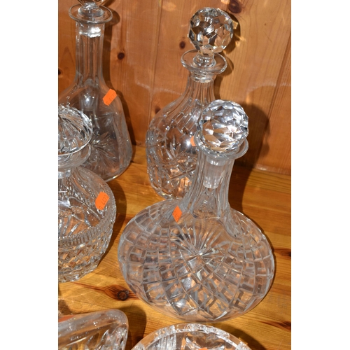 445 - A GROUP OF CUT CRYSTAL DECANTERS, comprising a Waterford Crystal dish, a Stuart Crystal tilting deca... 