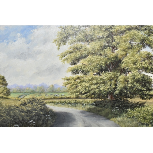 467 - JOHN D. ROBERTS (BRITISH CONTEMPORARY) AN ENGLISH SCHOOL LANDSCAPE, a road cuts through fields with ... 