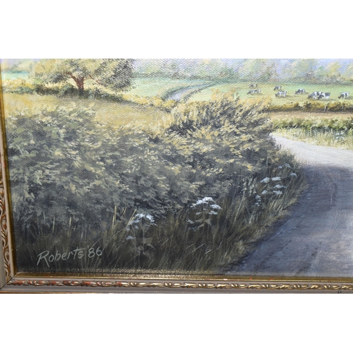 467 - JOHN D. ROBERTS (BRITISH CONTEMPORARY) AN ENGLISH SCHOOL LANDSCAPE, a road cuts through fields with ... 