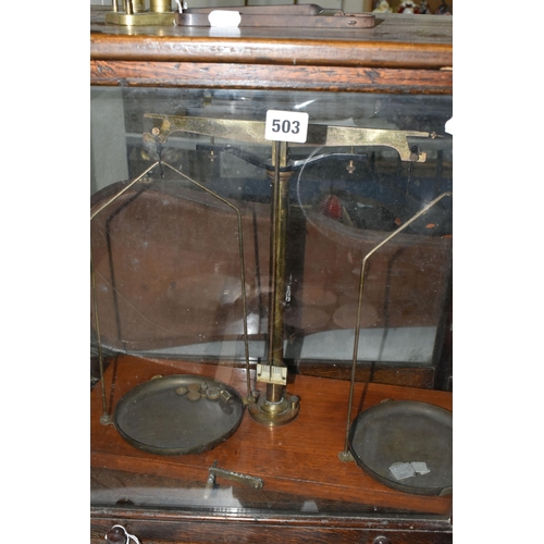 503 - A SET OF BALANCE SCALES, housed in a glazed oak case, approximate height of case 52cm, together with... 