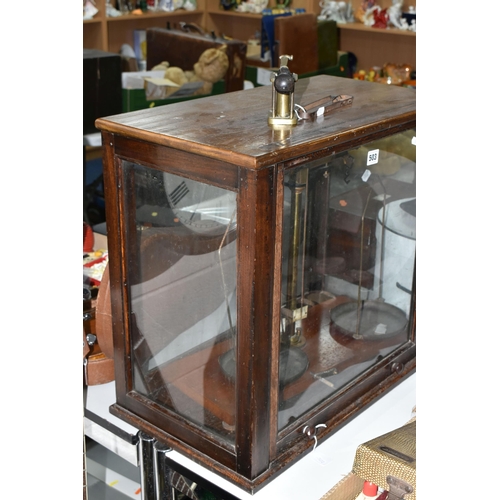 503 - A SET OF BALANCE SCALES, housed in a glazed oak case, approximate height of case 52cm, together with... 