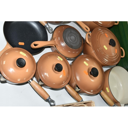 539 - TEN PIECES OF LE CREUSET CAST IRON COOKWARE, all with a cinnamon exterior, comprising a 27cm/4.1l ov... 