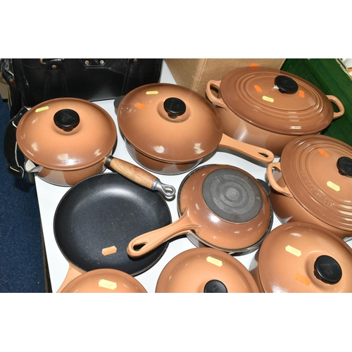 539 - TEN PIECES OF LE CREUSET CAST IRON COOKWARE, all with a cinnamon exterior, comprising a 27cm/4.1l ov... 