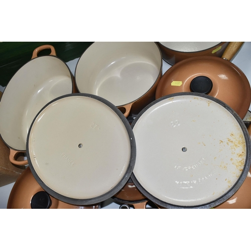 539 - TEN PIECES OF LE CREUSET CAST IRON COOKWARE, all with a cinnamon exterior, comprising a 27cm/4.1l ov... 