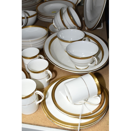 577 - ROYAL DOULTON 'ROYAL GOLD' DESIGN DINNERWARE, comprising nine cups (one chipped foot), seven saucers... 