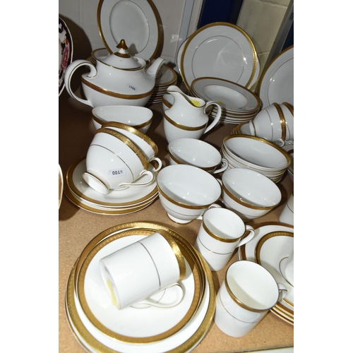 577 - ROYAL DOULTON 'ROYAL GOLD' DESIGN DINNERWARE, comprising nine cups (one chipped foot), seven saucers... 