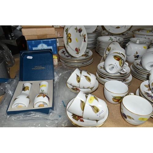 607 - ROYAL WORCESTER 'EVESHAM' PART DINNER SERVICE, comprising thirteen large cups and saucers, four smal... 