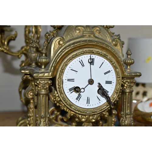 610 - A GROUP OF BRASS WARE, comprising an gilt Rococo style  mantel clock, bell striking mechanism stampe... 