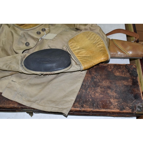 661 - A GOOD QUALITY RIFLE SHOOTING JACKET, a leather on oak shotgun case and a superb high quality fur li... 