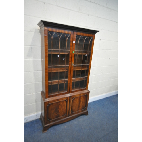 1424 -  A BEVAN FUNNELL MAHOGANY BOOKCASE, with two glazed doors and two cupboard doors, width 106cm x dept... 