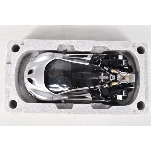 16 - A BOXED AUTOART SIGNATURE MODEL MCLAREN P1, 1:18 scale, numbered 76026 in matt chrome, appears in ne... 