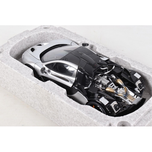 16 - A BOXED AUTOART SIGNATURE MODEL MCLAREN P1, 1:18 scale, numbered 76026 in matt chrome, appears in ne... 