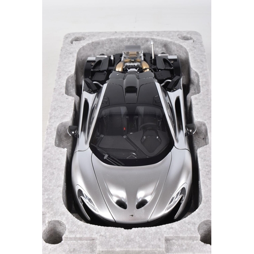 16 - A BOXED AUTOART SIGNATURE MODEL MCLAREN P1, 1:18 scale, numbered 76026 in matt chrome, appears in ne... 