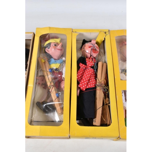 56 - SIX BOXED PELHAM PUPPETS, SL Pinocchio, LA Poodle, SM Witch, with broom, SS Mitzi, SS Golly and SL63... 