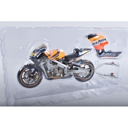 87 - TWO BOXED MINICHAMPS PAULS MODEL ART MOTORCYCLE MODELS 1:12 SCALE, the first is a Honda RC211V Repso... 