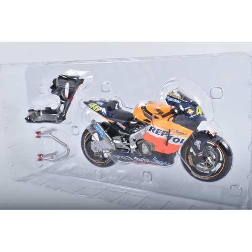 87 - TWO BOXED MINICHAMPS PAULS MODEL ART MOTORCYCLE MODELS 1:12 SCALE, the first is a Honda RC211V Repso... 