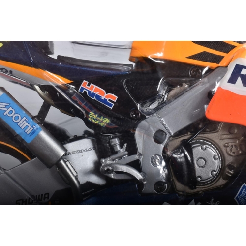 87 - TWO BOXED MINICHAMPS PAULS MODEL ART MOTORCYCLE MODELS 1:12 SCALE, the first is a Honda RC211V Repso... 