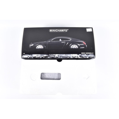 128 - A BOXED MINICHAMPS BENTLEY CONTINENTAL GT 1:18 SCALE MODEL VEHICLE, numbered 100 139020, black body,... 