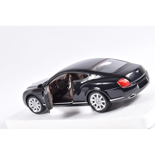 128 - A BOXED MINICHAMPS BENTLEY CONTINENTAL GT 1:18 SCALE MODEL VEHICLE, numbered 100 139020, black body,... 