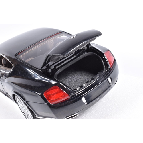 128 - A BOXED MINICHAMPS BENTLEY CONTINENTAL GT 1:18 SCALE MODEL VEHICLE, numbered 100 139020, black body,... 