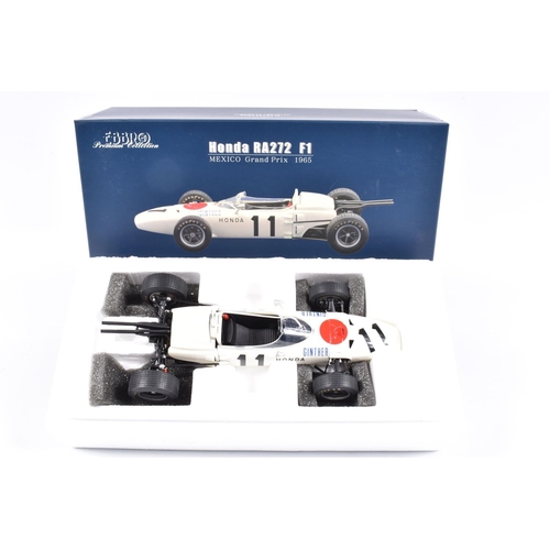 129 - TWO EBBRO PREMIUM COLLECTION HONDA RA271 F1 1:20 SCALE MODEL DIECAST VEHICLES, the first is a West G... 