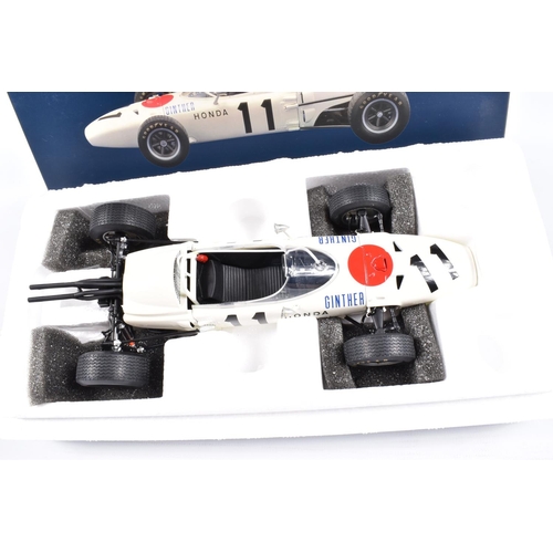 129 - TWO EBBRO PREMIUM COLLECTION HONDA RA271 F1 1:20 SCALE MODEL DIECAST VEHICLES, the first is a West G... 