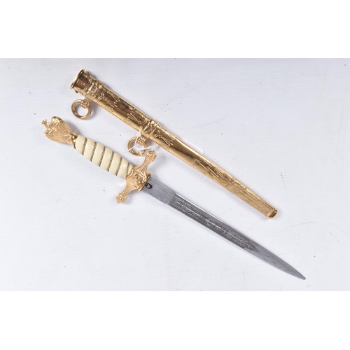 405 - A GERMAN KRIEGSMARINE OFFICERS DRESS DAGGER, this is in good condition, has a white celluloid grip w... 