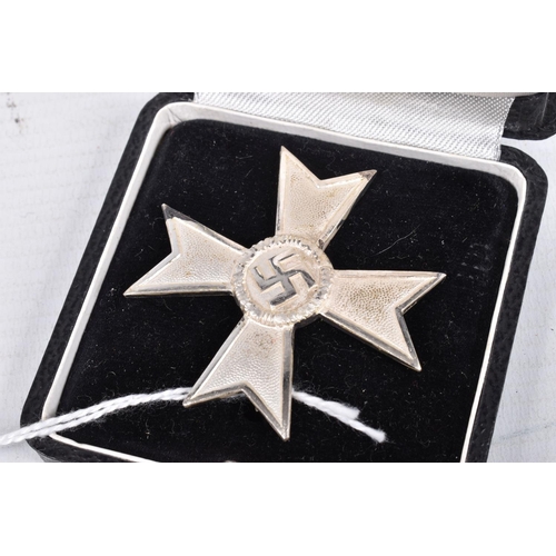 409 - A WWII FIRST CLASS GERMAN WAR MERIT CROSS IN FITTED BOX , this is a die cast silvered example with a... 