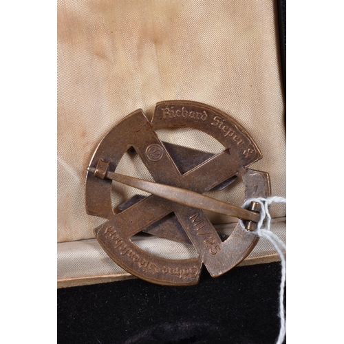 410 - A WWII STYLE GERMAN PROFICIENCY BADGE, this features the SS runes in the centre, the reverse has the... 