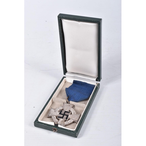 413 - A CASED GERMAN 25 YEAR FAITHFUL SERVICE MEDAL, this is silver in colour and comes with its blue ribb... 