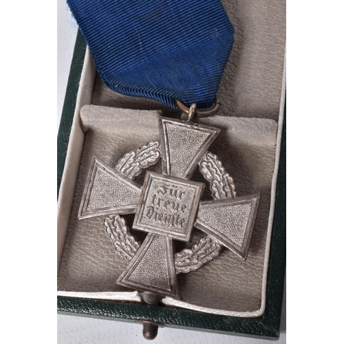 413 - A CASED GERMAN 25 YEAR FAITHFUL SERVICE MEDAL, this is silver in colour and comes with its blue ribb... 