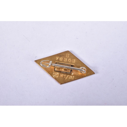 420 - A GERMAN THIRD REICH GOLD HITLER YOUTH BADGE, it has red, white and black enamel to the front with S... 