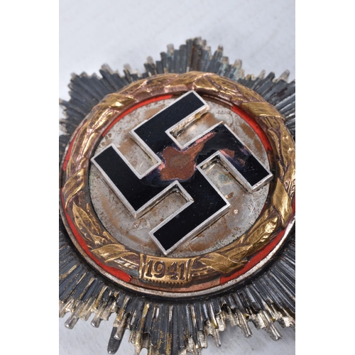 428 - A THIRD REICH GERMAN CROSS, this is marked on the reverse ULRICH MUNDT 5/ST 6.1 9.4.42, G.C, this co... 